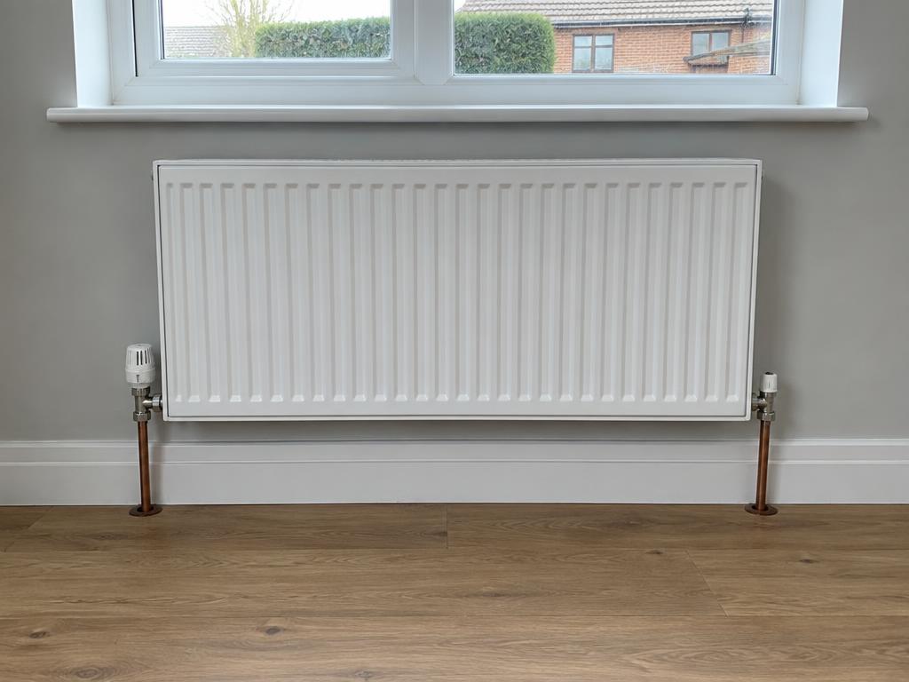 Double-panel radiator and thermostatic valve replacement, Farnham
